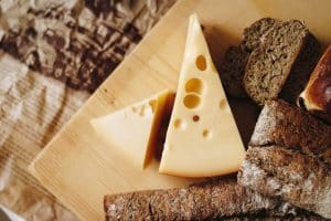 Sliced cheese on brown table top