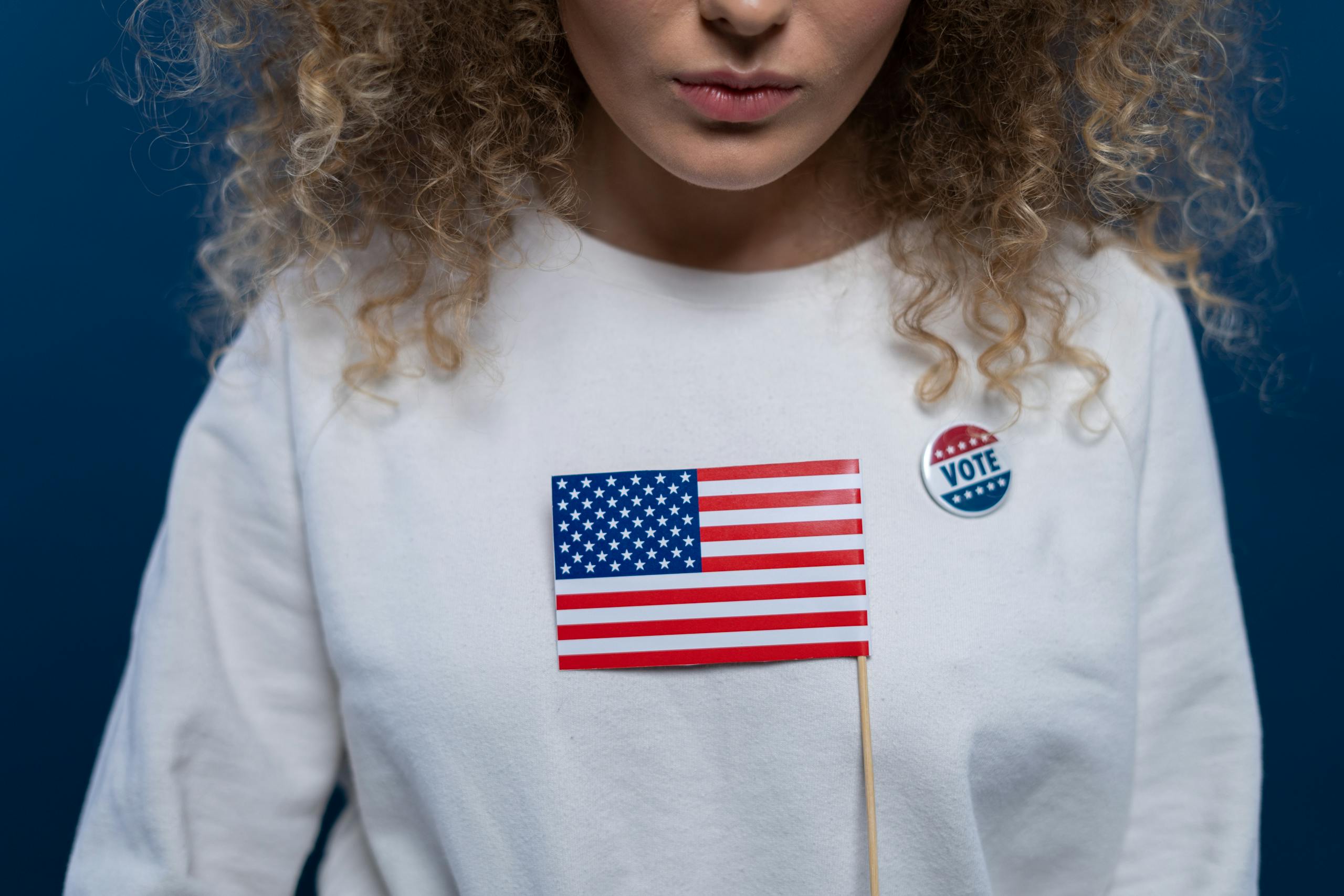 Voting woman with an american flag