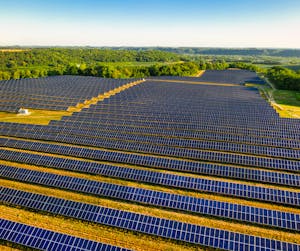 Aerial view of a vast solar farm in Red Wing, MN, generating renewable energy.