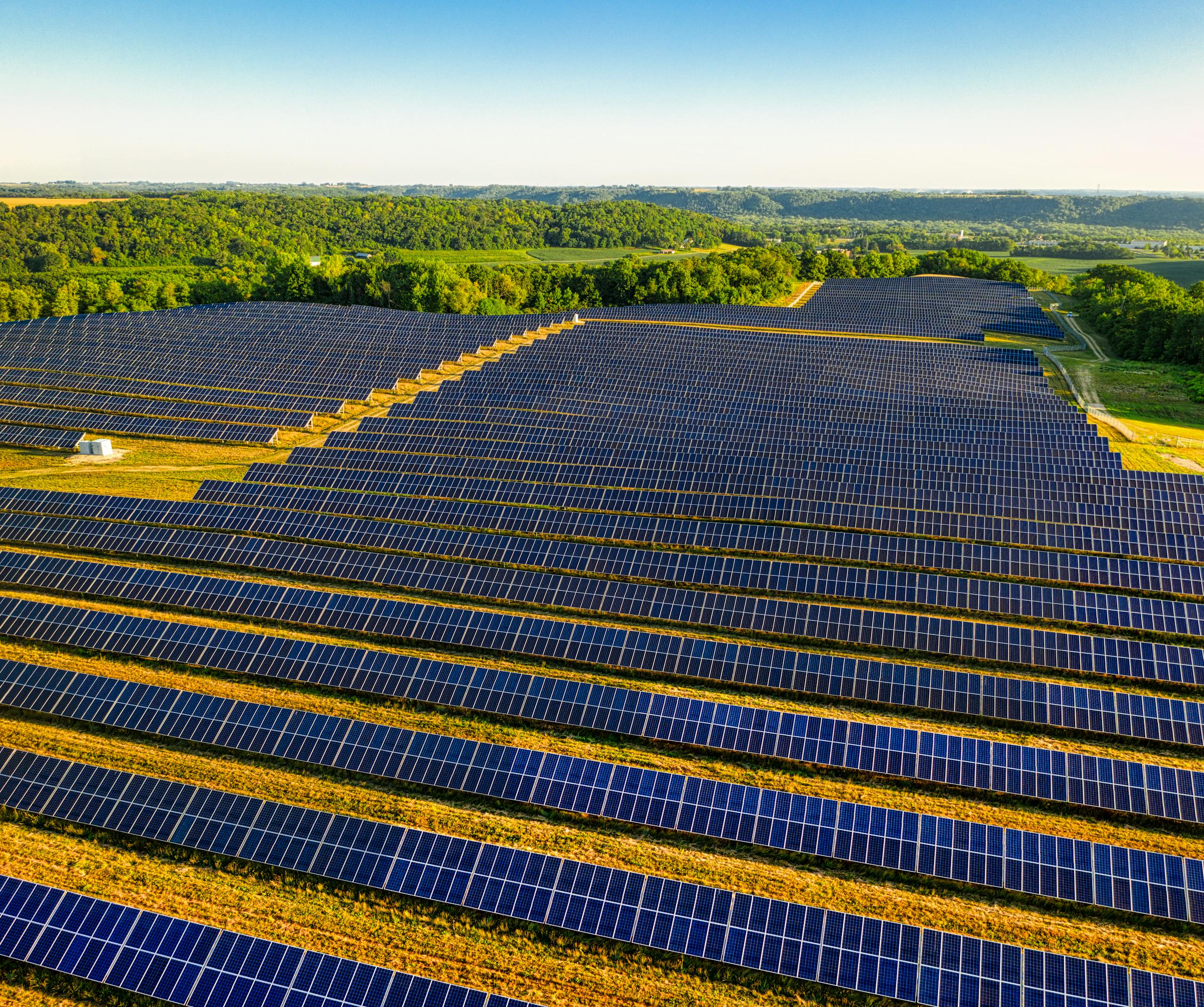 Aerial view of a vast solar farm in Red Wing, MN, generating renewable energy.