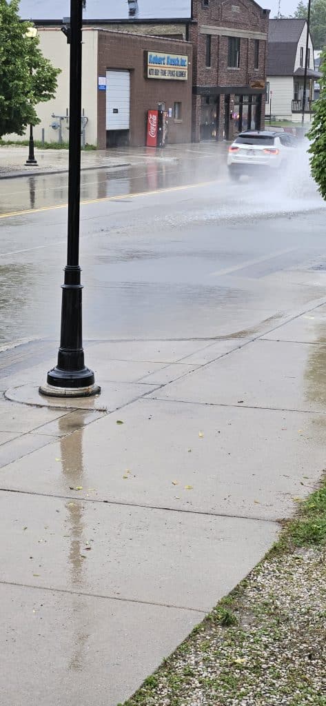 Rainfall pooled quickly at 11th & Indiana Avenue as storm drains briefly fell behind during Wednesday’s fast-moving thunderstorm.